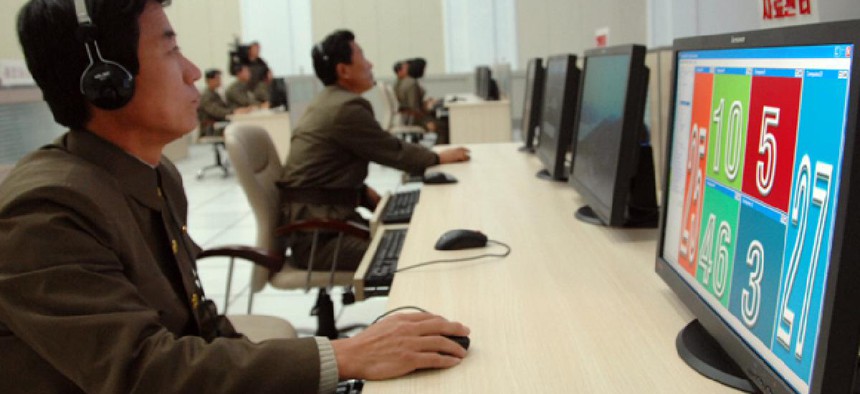 Scientists and technicians work on their computers to control the launch of North Korea's Unha-3 rocket  in Pyongyang, North Korea on Dec. 12, 2012.