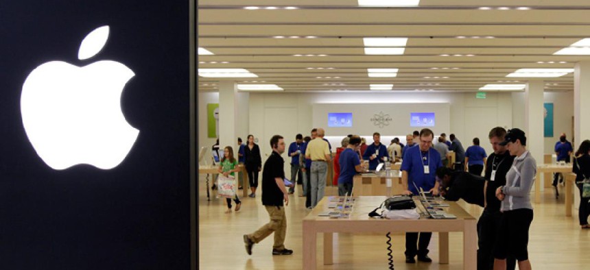 People shop in an Apple store at a mall in Cheektowaga, N.Y.