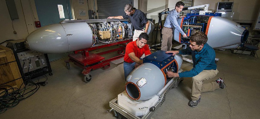 Researchers prepare pods that, airborne, will track radiation to its source and identify nuclear bombs.