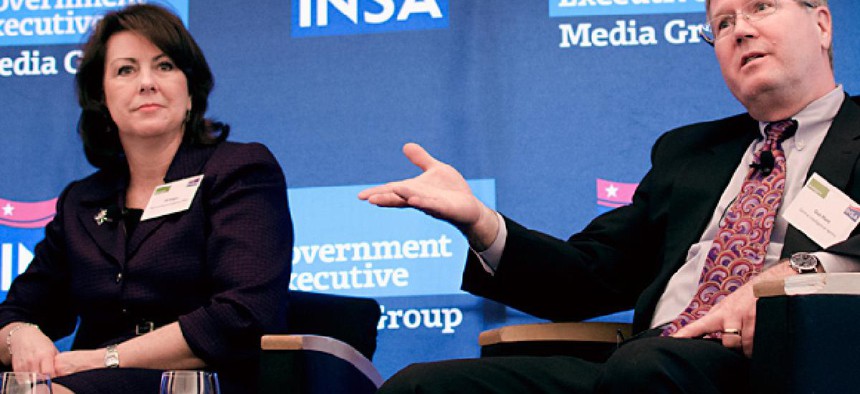 National Reconnaissance Office CIO Jill Singer, left, and CIA Chief Information Officer Gus Hunt at a forum hosted by Nextgov and INSA