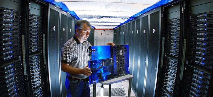 A Sandia reseracher inspects a Thunderbird supercomputer component. 