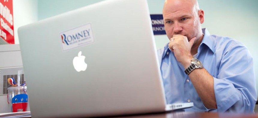 A Romney volunteer works on a campaign Facebook page in 2012.