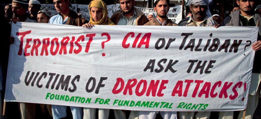 Pakistani tribal villagers hold a rally to condemn U. S. drone attacks.