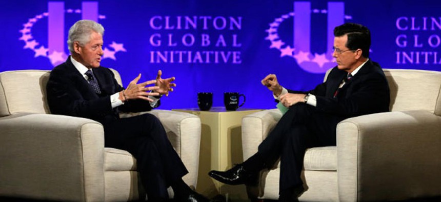 Former President Bill Clinton, left, and Comedy Central's Stephen Colbert during the Clinton Global Initiative at Washington University in St. Louis