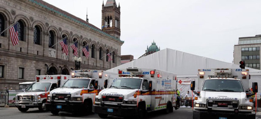 Ambulances wait near the medical tent at the Boston Marathon Monday.