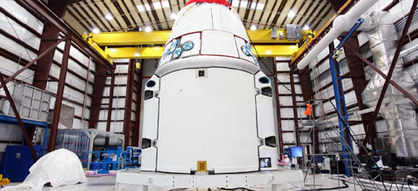 The SpaceX Dragon spacecraft inside a processing hangar at Cape Canaveral Air Force Station in Cape Canaveral, Fla. 