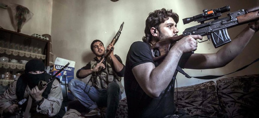  A rebel sniper aims at Syrian army positions in the Aleppo Jedida district, Syria.