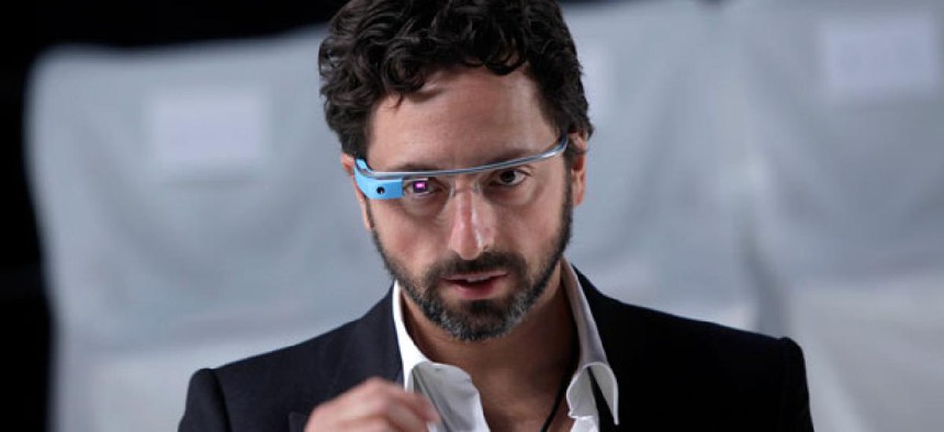 Google co-founder Sergey Brin dons a pair of Google Glasses