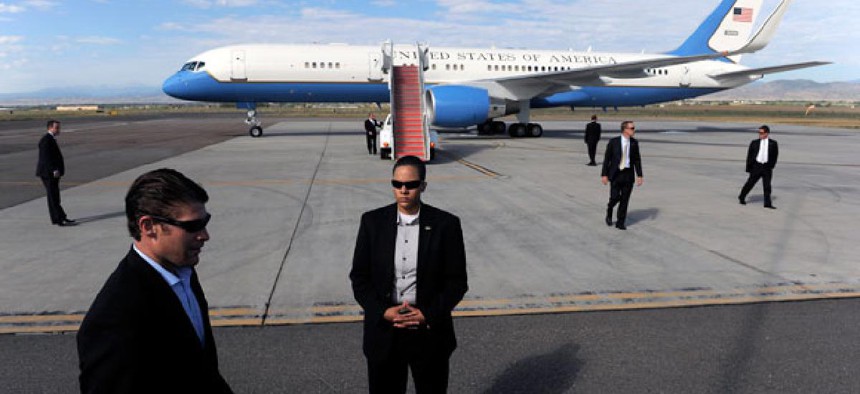 Secret Service agents Members of the Secret Service surround Air Force One as President Barack Obama prepares to depart the plane in September.