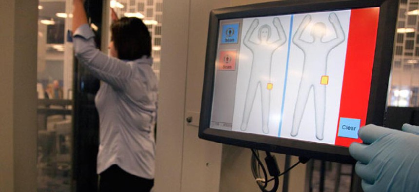 A TSA employee demonstrates an Advanced Imaging Technology scanner at Las Vegas' McCarran International Airport in 2011.