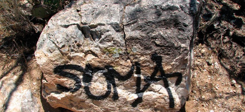Significant graffiti damage is seen along the Douglas Springs Trail in Saguaro National Park near Tucson, Arizona.