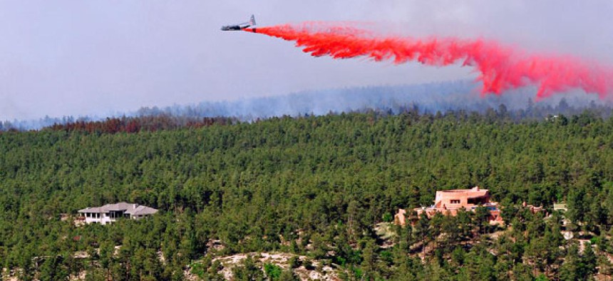 A DC-10 airtanker drops chemicals to contain fires in Colorado this week.