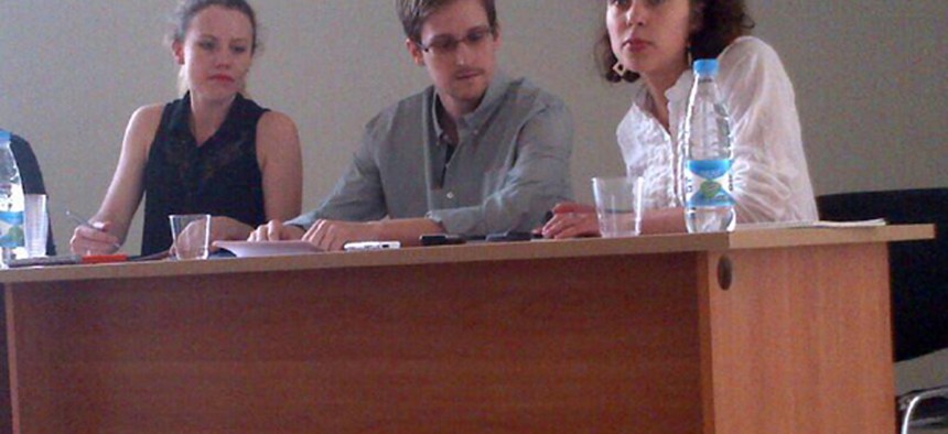 Edward Snowden, flanked by Sarah Harrison of WikiLeaks (right) and an unidentified woman.