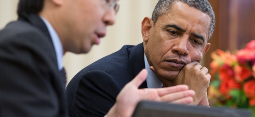 Todd Park and Barack Obama look at information on a tablet computer in April.