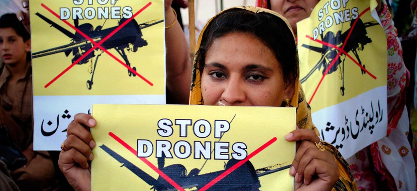 Pakistan women take part in a rally against the U.S. drone strikes in Pakistani tribal areas in Peshawar, Pakistan. 