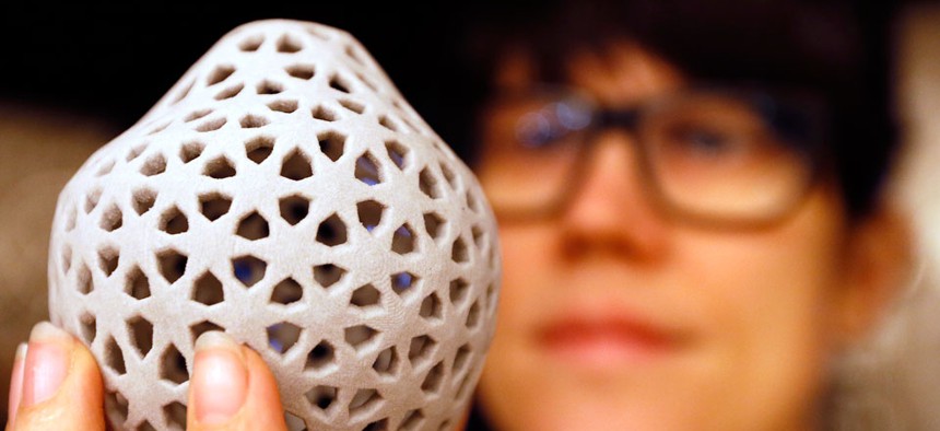 Designer Penelope Kupfer displays a 3D printed biscuit. 