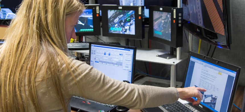 Astronaut Karen Nyberg uses the virtual reality lab in the Space Vehicle Mock-up Facility at Johnson Space Center in January.