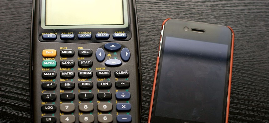 The TI-83 calculator matched up with an iPhone