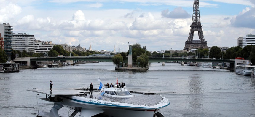 The Turanor PlanetSolar, the world's largest solar boat, travels on the Seine river in Paris, France. 