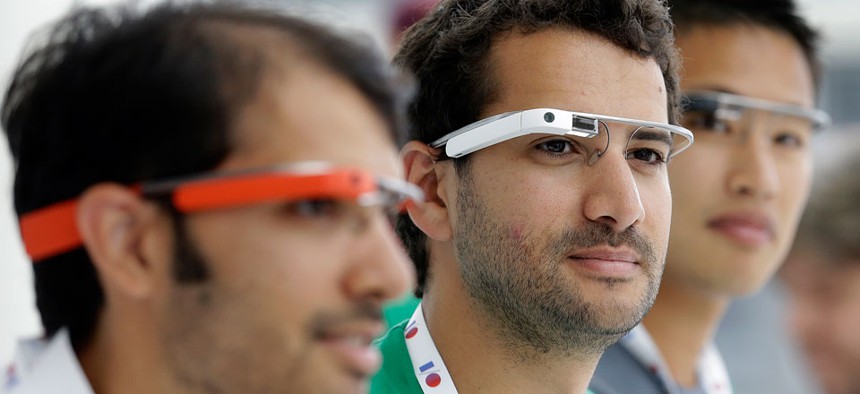 Google Glass team members wear Google Glasses. 