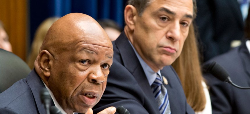 Rep. Elijah Cummings, D-Md., the ranking member of the House Oversight and Government Reform Committee, left, accompanied by the committee's Chairman Rep. Darrell Issa, R-Calif.