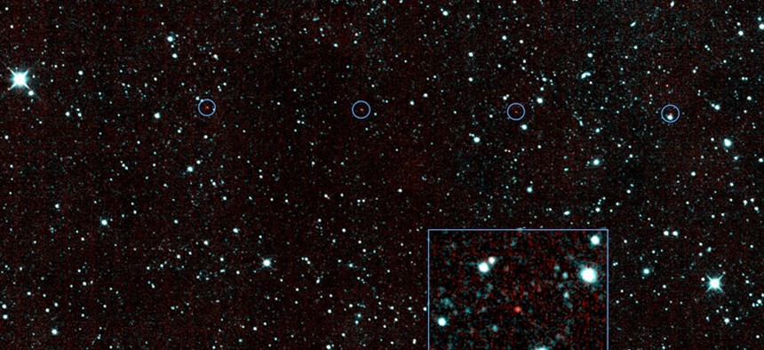 The six red dots in this composite picture indicate the location of the first new near-Earth asteroid seen by NASA's Near-Earth Object Wide-field Infrared Survey Explorer. 