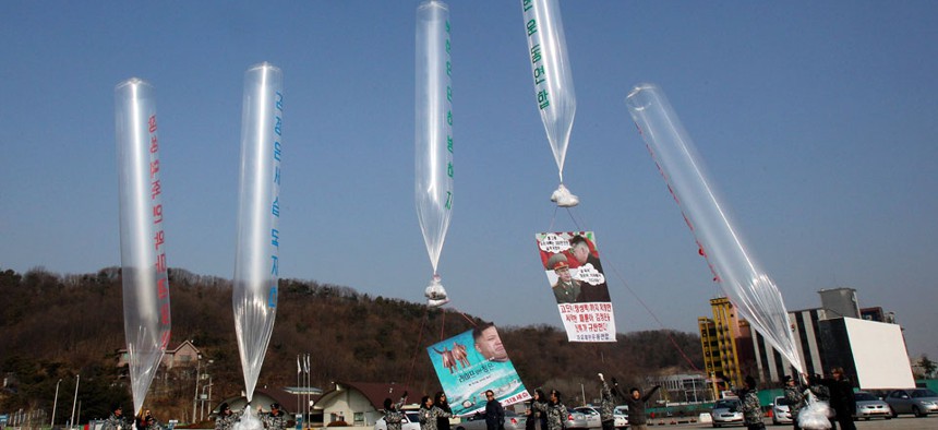 North Korean defectors and human right activists release balloons due to fly to the North, carrying leaflets to condemn North Korean leader Kim Jong Un.