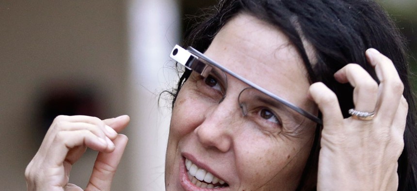 Cecilia Abadie wore her Google Glass as she talks with her attorney outside of traffic court in December.