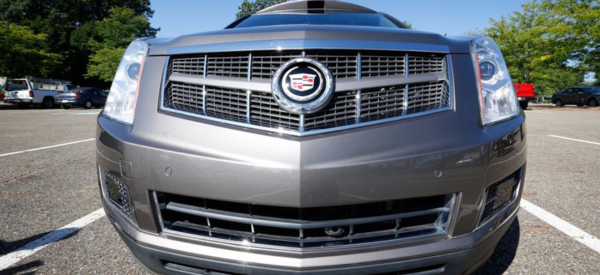 Infrared sensors and a low mounted camera can be seen below the bumper of this Cadillac SRX that was modified to be driverless by Carnegie Mellon University.