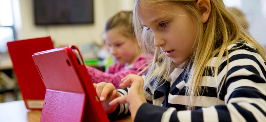 Ella Russell, 7, working on an e-book on an iPad during her second grade class at Jamestown Elementary School in Arlington, Va., in November.
