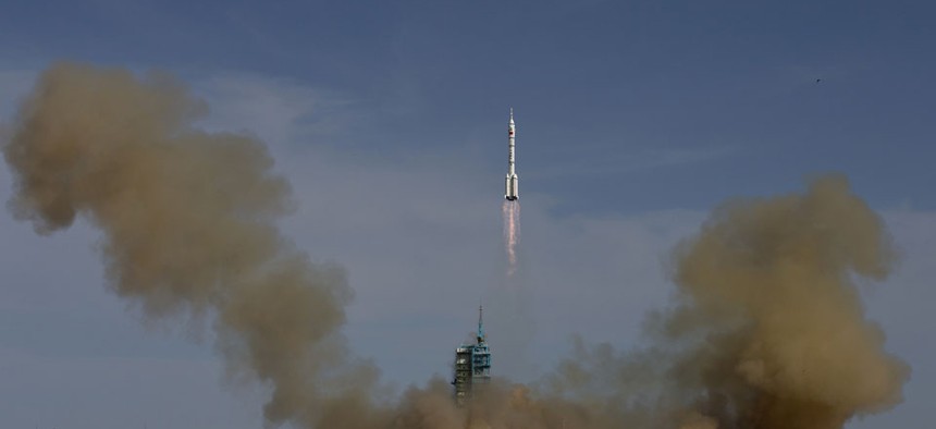 The Long March 2F rocket carrying the Shenzhou 10 capsule blasts off in China in 2013.