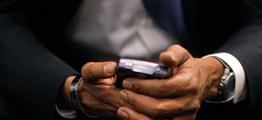 Then-Democratic presidential candidate, Sen. Barack Obama, D-Ill., checks his BlackBerry in 2008.
