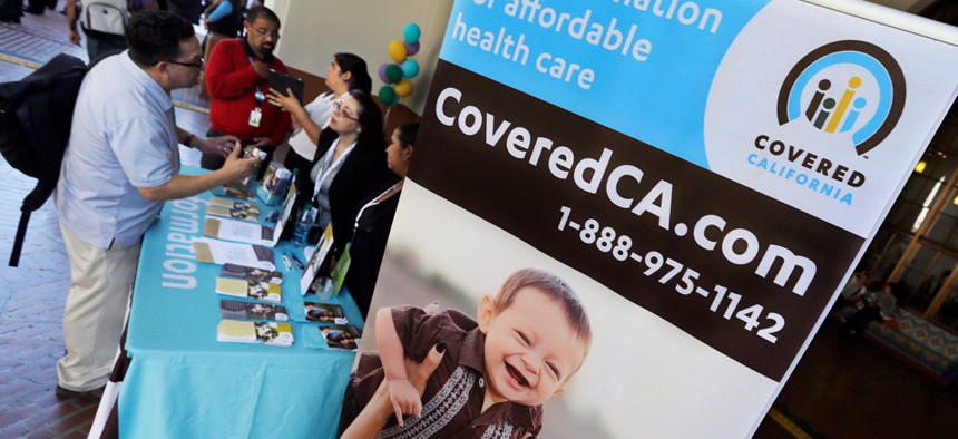 An information table advertising California's health care exchange sits in downtown Los Angeles in January.