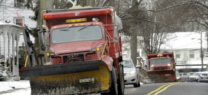 Snow plows drive down the clear streets in Allentown, N.J., Monday, March 17, 2014.