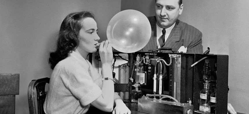 A breathalyzer prototype demonstrated in 1950.