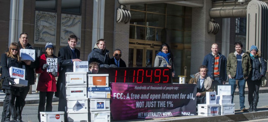 Members of US advocacy groups camp outside FCC headquarters in Washington, DC, on Jan. 30, 2014
