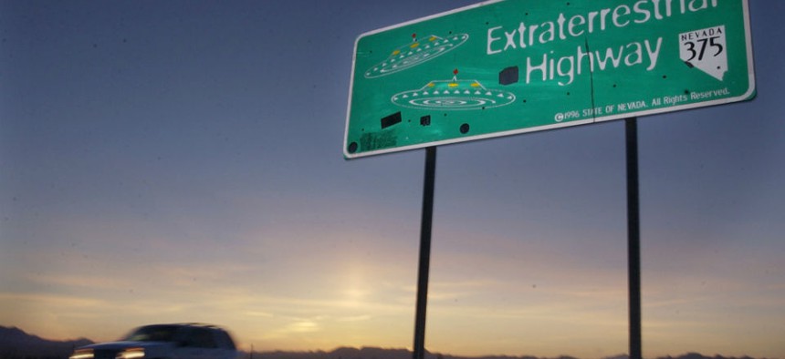 A car moves along the Extraterrestrial Highway near Rachel, Nevada, and along the border of Area 51.