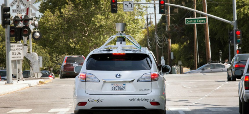 A Google driverless car navigating along a street in Mountain View, California.