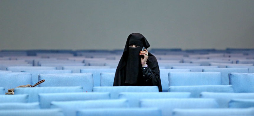 A female supporter of Afghan presidential candidate Ashraf Ghani Ahmadzai talks on the phone after a campaign rally for women in Kabul.