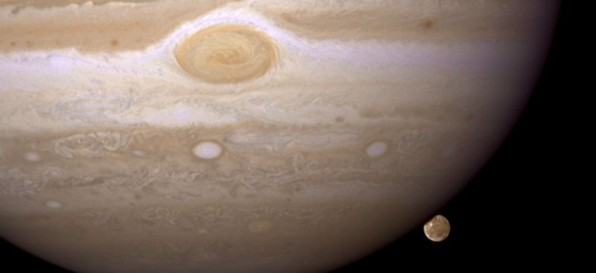 Jupiter's moon Ganymede playing a game of "peek-a-boo."