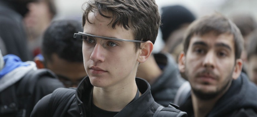 An Apple Worldwide Developers Conference attendee wears Google Glass in San Francisco.