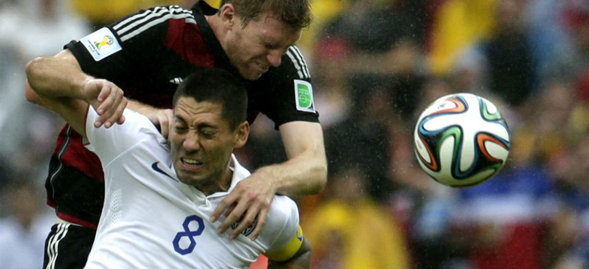 Germany's Per Mertesacker, back, and United States' Clint Dempsey go for a header during the World Cup.
