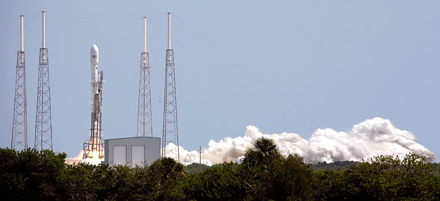 A SpaceX Falcon 9 rocket, carrying a payload of Orbcomm communications satellites, lifts off from launch complex 40 at the Cape Canaveral Air Force Station in Cape Canaveral, Fla.