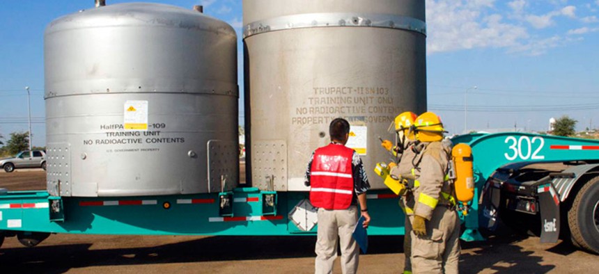 Firefighters practice responding to a simulated incident involving a WIPP shipment during an exercise.