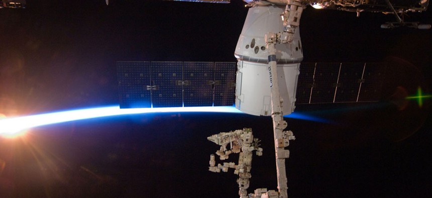 The SpaceX Dragon capsule berths at the International Space Station