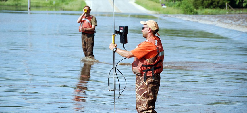 USGS personnel monitoring flood waters in Waverly, IA 