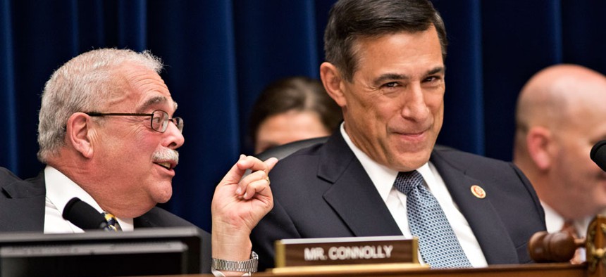  House Oversight Committee Chairman Darrell Issa, R-Calif., right, reacts to Rep. Gerry Connolly, D-Va.