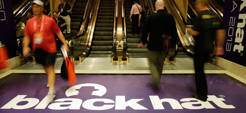 Hackers and security personal attend the Black Hat hacker conference.