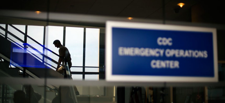 An official with the U.S. Centers for Disease Control and Prevention exits the agency's Emergency Operations Center.