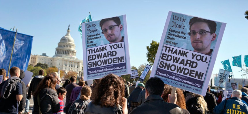 Demonstrators rally at the U.S. Capitol to protest spying on Americans by the National Security Agency.